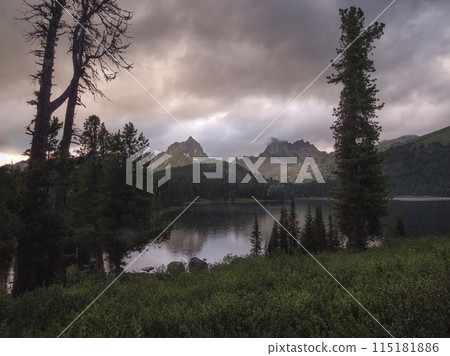 Rain at sunset at a mountain lake. Ergaki Nature Park 115181886