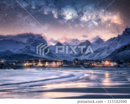 Milky Way and sandy beach, sea, snowy rocks, lights, starry sky 115182090