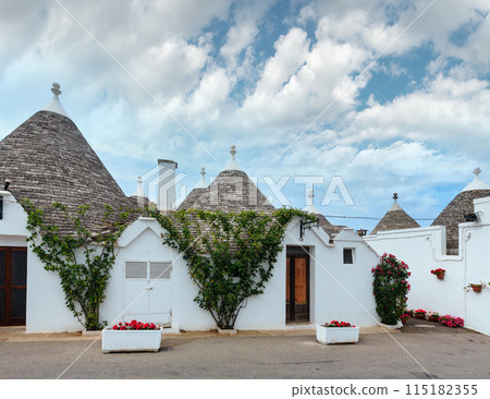 Trulli houses street in Alberobello, Italy 115182355