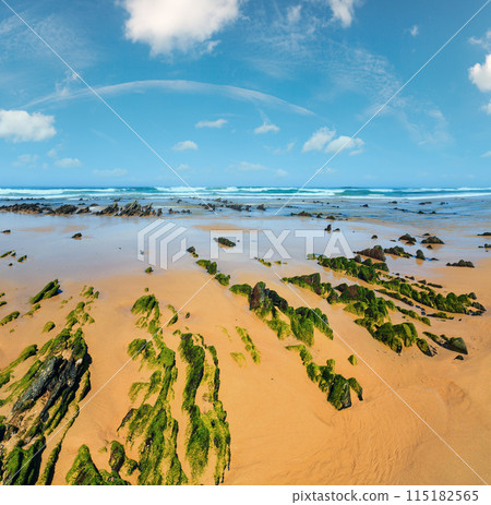 Rock formations on sandy beach (Portugal). Rock formations on sandy beach (Portugal). 115182565