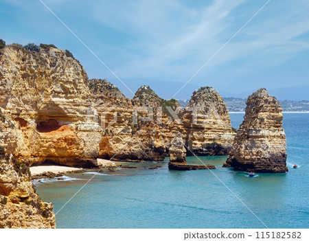 Yellow rocky coast (Lagos, Algarve, Portugal). 115182582