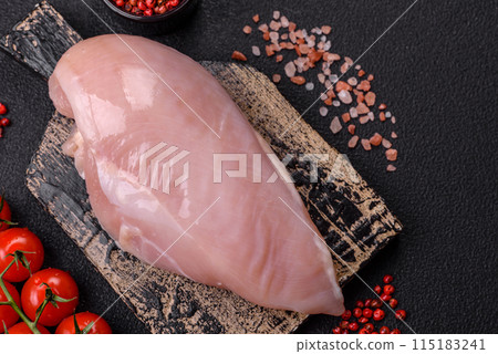 Fresh chicken fillet on a dark concrete table with spices and herbs 115183241