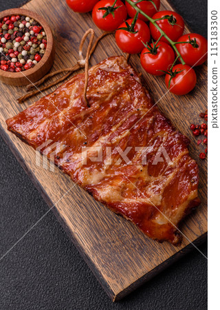 Delicious juicy grilled ribs baked on the grill with salt, spices and herbs 115183300