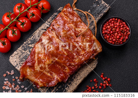 Delicious juicy grilled ribs baked on the grill with salt, spices and herbs 115183316
