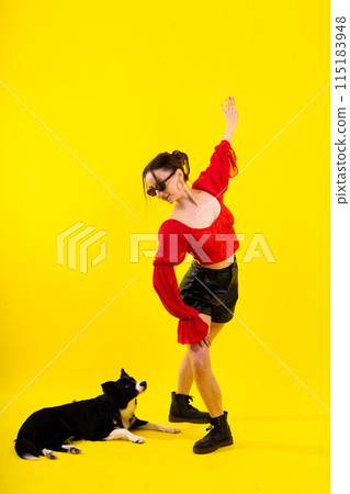 A beautiful sport female with border collie in studio A beautiful sport female with border collie in studio 115183948