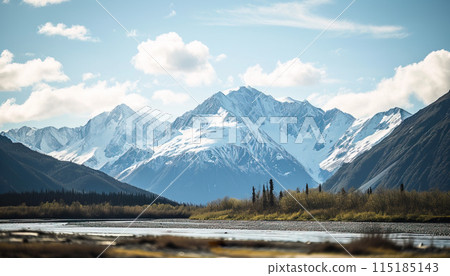 Snowy mountains of Alaska, landscape with forests, valleys, and rivers in daytime. Breathtaking nature composition background wallpaper, travel destination, adventure outdoors 115185143
