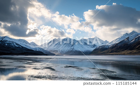Snowy mountains of Alaska, landscape with forests, valleys, and rivers in daytime. Breathtaking nature composition background wallpaper, travel destination, adventure outdoors 115185144