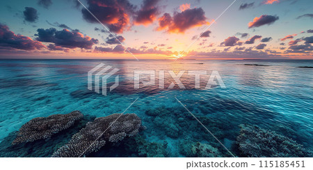 Great Barrier Reef on the coast of Queensland, Australia seascape. Coral sea marine ecosystem wallpaper background at sunset, with an orange purple sky in the evening golden hour 115185451