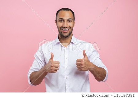 Satisfied man in white shirt showing like sign with both hands Satisfied man in white shirt showing like sign with both hands 115187381