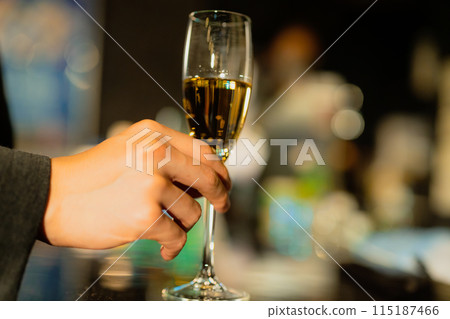 Man drinking at a bar 115187466