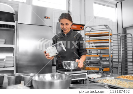 Experienced chef in professional kitchen preparing dough with flour to make bread Experienced chef in professional kitchen preparing dough with flour to make bread 115187492
