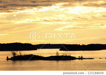 View from a boat across the islands of Lake Mälaren during the midnight sun View from a boat across the islands of Lake Mälaren during the midnight sun 115188039