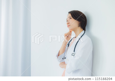 A woman in a white coat A woman in a white coat 115188204