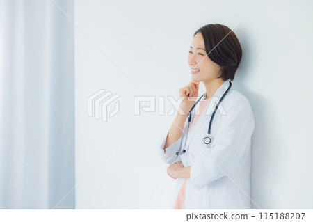 A woman in a white coat 115188207