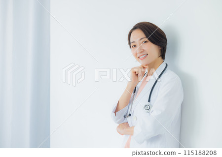 A woman in a white coat 115188208