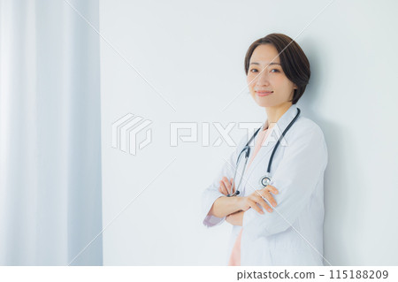 A woman in a white coat 115188209