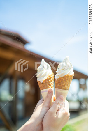 Eating soft serve ice cream on the plateau - no face 115189498