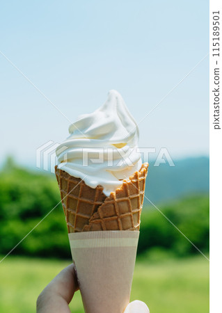 Eating soft serve ice cream on the plateau - no face 115189501