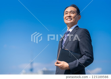 A refreshing middle-aged male businessman with a smile A refreshing middle-aged male businessman with a smile 115189566