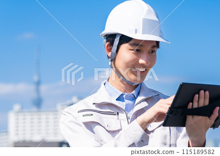 A young male engineer conducting a maintenance inspection 115189582