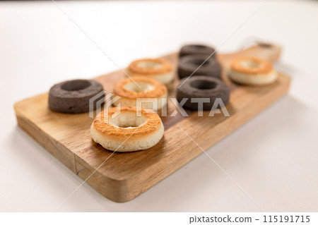 Baked donuts on a cutting board Baked donuts on a cutting board 115191715
