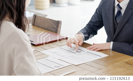 The hands of a businessman making a sales call 115192613