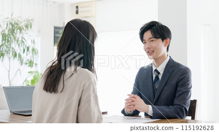 Businessman making a sales call 115192628