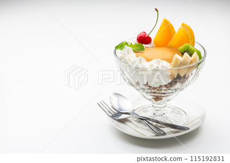 Pudding a la mode in a glass bowl on a white background with copy space 115192831