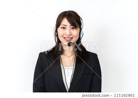 A woman wearing a headset giving directions A woman wearing a headset giving directions 115192901