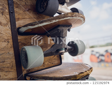 A stack of skateboards on a special outdoor stand 115192974