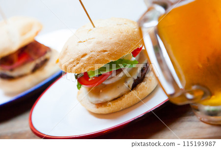 Beef burger served in cafe Beef burger served in cafe 115193987