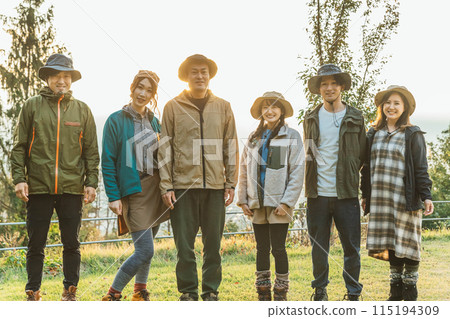 Male and female Asian campers camping and hiking together (looking at camera) Male and female Asian campers camping and hiking together (looking at camera) 115194309