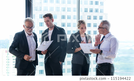 Executive businessmen and businesswomen teamwork standing and taking about together business. Executive businessmen and businesswomen teamwork standing and taking about together business. 115194422