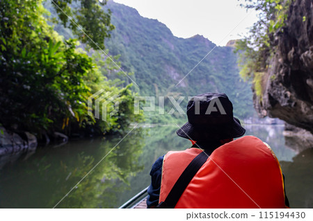 Vietnam Hanoi: Experience a boat tour in Ninh Binh, rowing a river in a valley 115194430