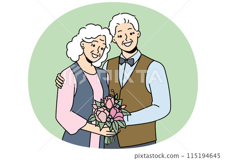 Elderly couple in love smiles rejoicing at happy family life and poses for picture to golden wedding 115194645