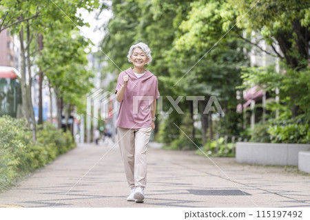 Senior woman walking Senior woman walking 115197492