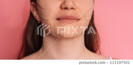 Face tape pasted all over lady's face on pink background Face tape pasted all over lady's face on pink background 115197501