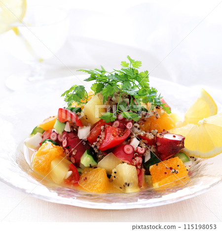 Refreshing summer ceviche with octopus, fruit and quinoa marinated salad 115198053
