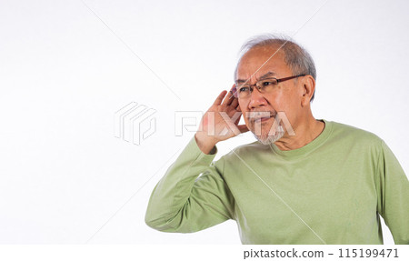 Portrait Asian old man with glasses and a beard listening to sound something, possibly engaged in conversation or trying to understand a message, hand on ear hearing a rumor isolated white background Portrait Asian old man with glasses and a beard listening to sound something, possibly engaged in conversation or trying to understand a message, hand on ear hearing a rumor isolated white background 115199471
