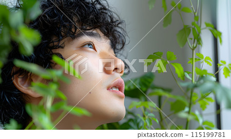 Asian man contemplating in nature 115199781