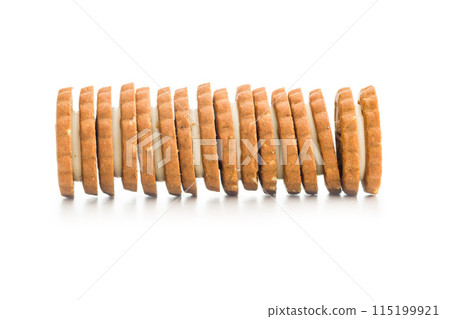 Sandwich Cookies with a cream filling isolated on white background. 115199921