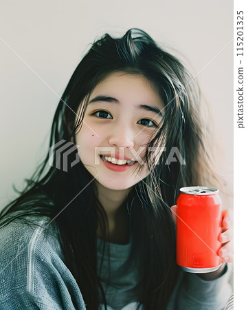 Asian woman refreshing herself with canned juice 115201325