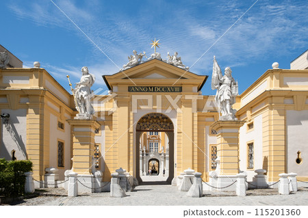 Grand entrance of the historic Melk Abbey in Austria, showcasing intricate statues and architectural details Grand entrance of the historic Melk Abbey in Austria, showcasing intricate statues and architectural details 115201360