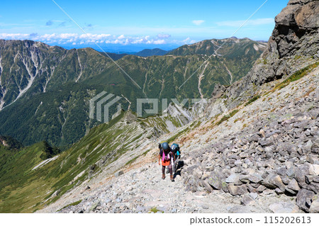 A female climber ascending the Nishikama Ridge on the trail to Mount Yari 115202613