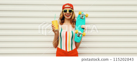 Summer portrait of happy cheerful stylish young woman with skateboard posing in colorful clothes 115202843