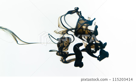 Black ink swirls forming delicate patterns as they diffuse elegantly through clear water, resembling an abstract ballet. 115203414