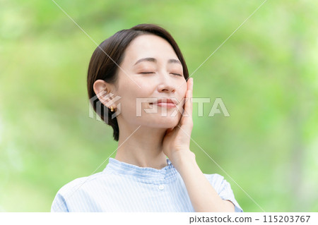 Middle-aged woman beauty green 115203767