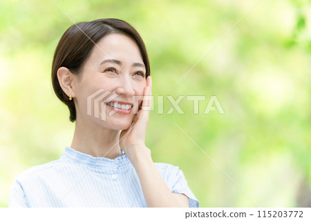 Middle-aged woman beauty green 115203772