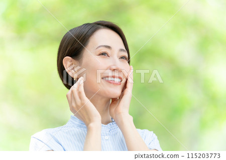 Middle-aged woman beauty green 115203773