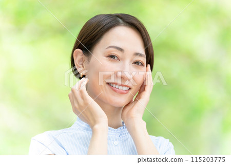 Middle-aged woman beauty green 115203775